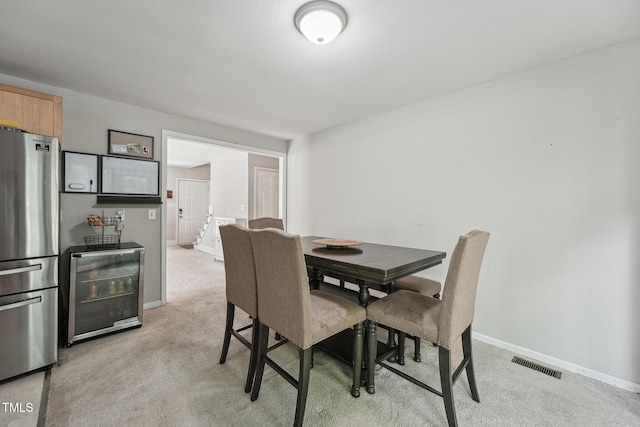 2028 Ruddy Rd, Raleigh, NC 27616 - dining area with wine cooler, baseboards, visible vents, and light carpet