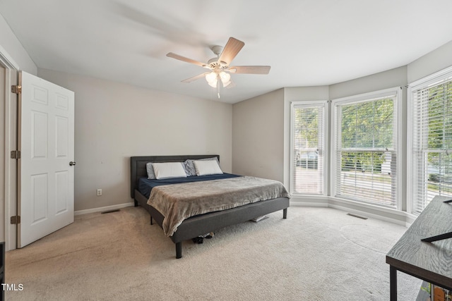 2028 Ruddy Rd, Raleigh, NC 27616 - bedroom with a ceiling fan, visible vents, light carpet, and baseboards