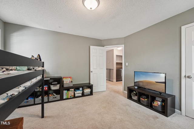 2028 Ruddy Rd, Raleigh, NC 27616 - playroom featuring baseboards, a textured ceiling, and carpet flooring