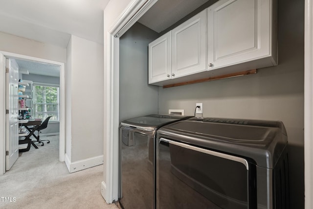2028 Ruddy Rd, Raleigh, NC 27616 - laundry room with baseboards, cabinet space, light colored carpet, and independent washer and dryer