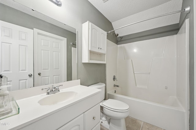 2028 Ruddy Rd, Raleigh, NC 27616 - bathroom featuring tile patterned floors, toilet, vanity, washtub / shower combination, and a textured ceiling