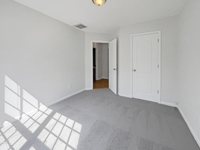 107 Kinship Ln, Apex, NC 27502 - unfurnished bedroom featuring baseboards, visible vents, and carpet