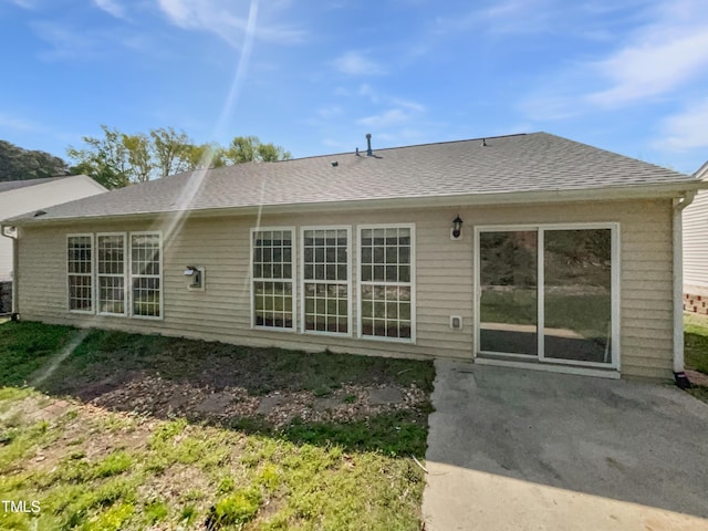 107 Kinship Ln, Apex, NC 27502 - back of house featuring a patio area and a shingled roof