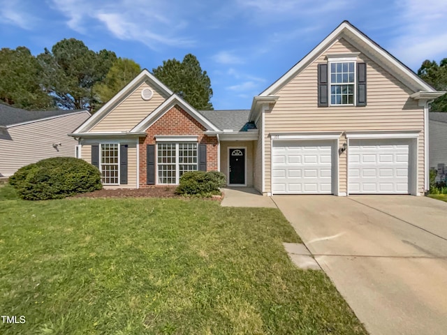 107 Kinship Ln, Apex, NC 27502 - view of front facade featuring a garage, brick siding, a front yard, and concrete driveway