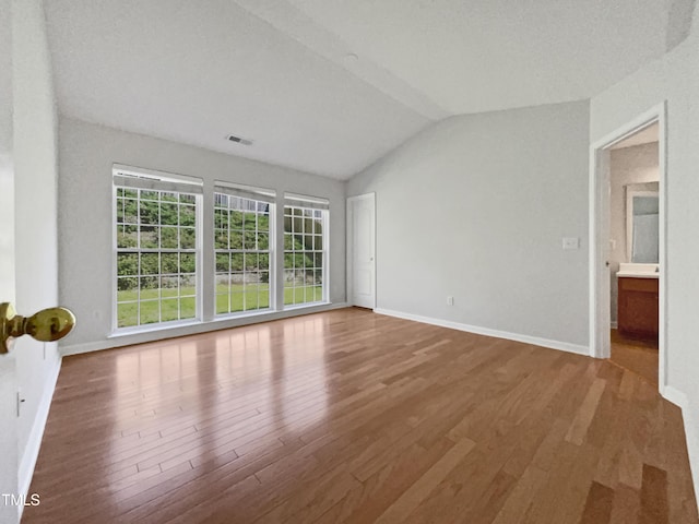 107 Kinship Ln, Apex, NC 27502 - interior space with lofted ceiling, baseboards, wood finished floors, and visible vents