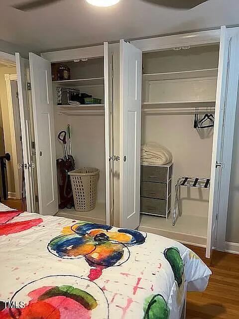 bedroom featuring wood finished floors and a closet