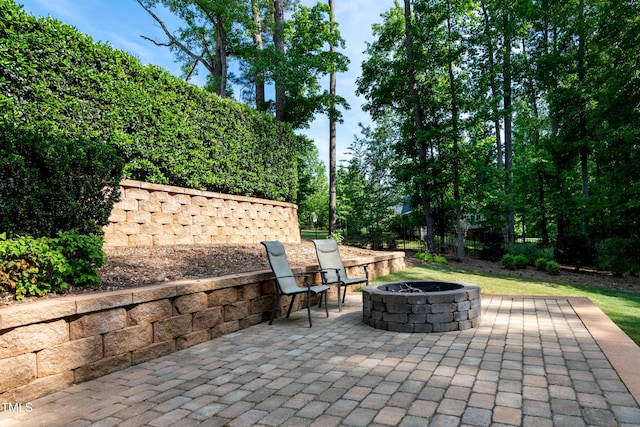 view of patio / terrace with an outdoor fire pit