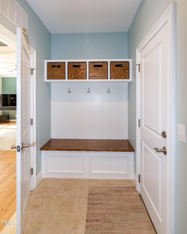 mudroom featuring ceiling fan, light tile patterned flooring, and visible vents