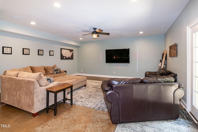 living area featuring a ceiling fan, concrete flooring, recessed lighting, and baseboards