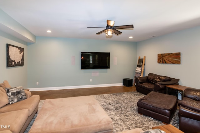 living area with baseboards, ceiling fan, recessed lighting, and concrete floors