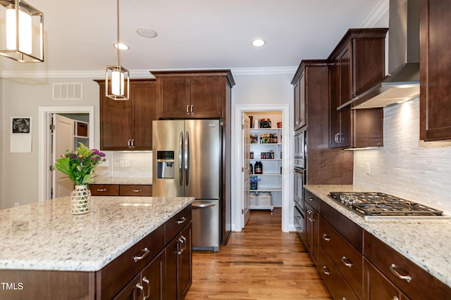 1820 Yates Wheel Way, Raleigh, NC 27606 - kitchen featuring stainless steel appliances, ornamental molding, wall chimney exhaust hood, light stone countertops, and light wood-style floors