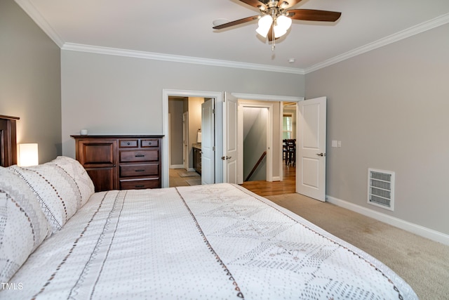 1820 Yates Wheel Way, Raleigh, NC 27606 - bedroom featuring crown molding, baseboards, light carpet, ceiling fan, and connected bathroom