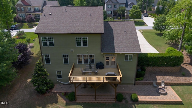 1820 Yates Wheel Way, Raleigh, NC 27606 - back of property featuring a wooden deck, french doors, a residential view, roof with shingles, and a yard