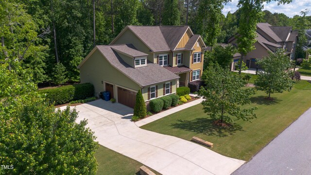 1820 Yates Wheel Way, Raleigh, NC 27606 - craftsman house featuring driveway, a front lawn, and a shingled roof