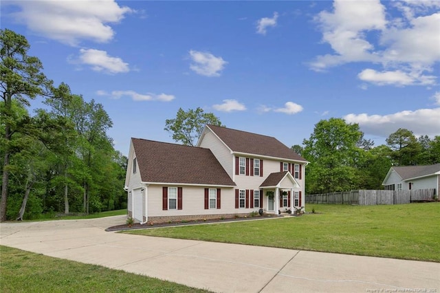 119 Woodbine Dr, Raeford, NC 28376 - colonial house featuring concrete driveway and an attached garage