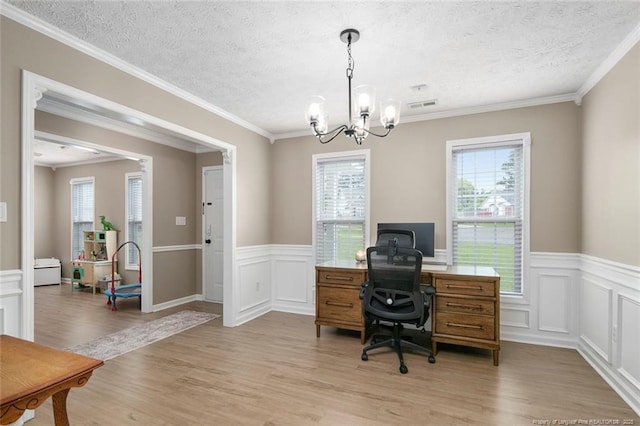 119 Woodbine Dr, Raeford, NC 28376 - office space with a chandelier, plenty of natural light, light wood-style flooring, a textured ceiling, and a wainscoted wall