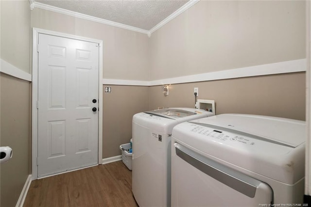 119 Woodbine Dr, Raeford, NC 28376 - washroom featuring washer and clothes dryer, wood finished floors, crown molding, baseboards, and a textured ceiling