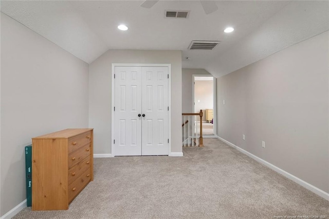 119 Woodbine Dr, Raeford, NC 28376 - unfurnished bedroom with lofted ceiling, light colored carpet, baseboards, a closet, and recessed lighting