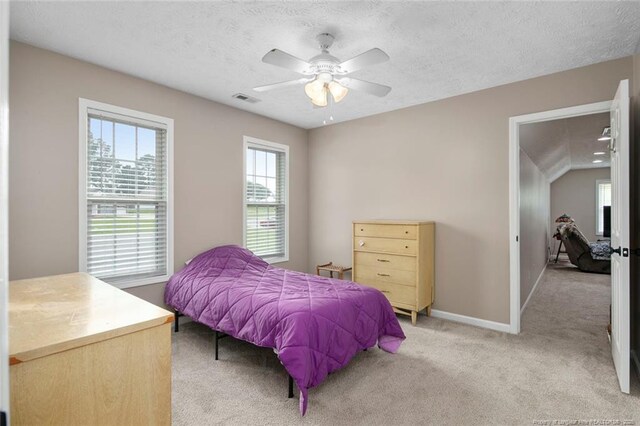119 Woodbine Dr, Raeford, NC 28376 - bedroom with light carpet, baseboards, a textured ceiling, and ceiling fan