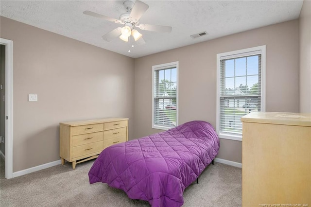 119 Woodbine Dr, Raeford, NC 28376 - bedroom featuring carpet floors, baseboards, ceiling fan, and a textured ceiling