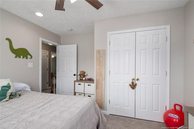 119 Woodbine Dr, Raeford, NC 28376 - carpeted bedroom featuring a closet, a textured ceiling, a ceiling fan, and recessed lighting