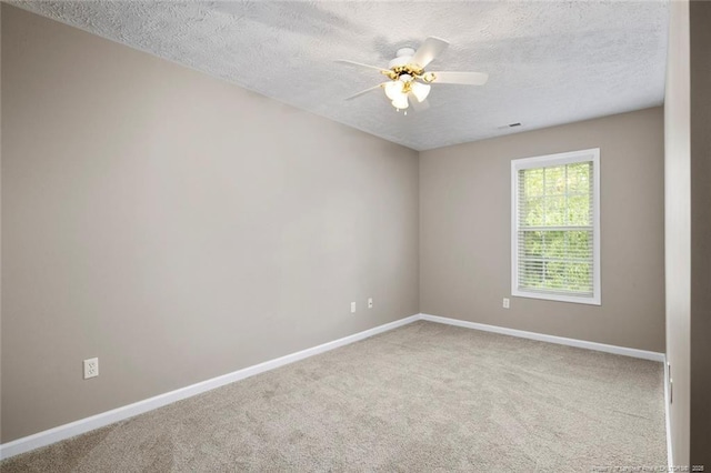 119 Woodbine Dr, Raeford, NC 28376 - spare room featuring a textured ceiling, carpet, baseboards, and a ceiling fan