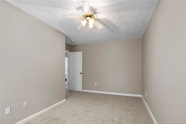 119 Woodbine Dr, Raeford, NC 28376 - spare room featuring a textured ceiling, ceiling fan, carpet, and baseboards