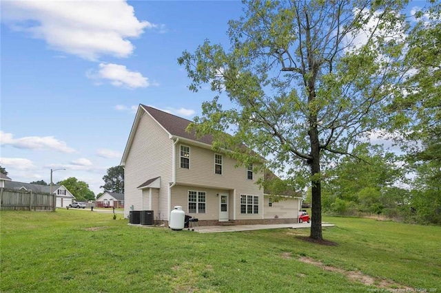 119 Woodbine Dr, Raeford, NC 28376 - back of house featuring a yard, a patio area, and central AC