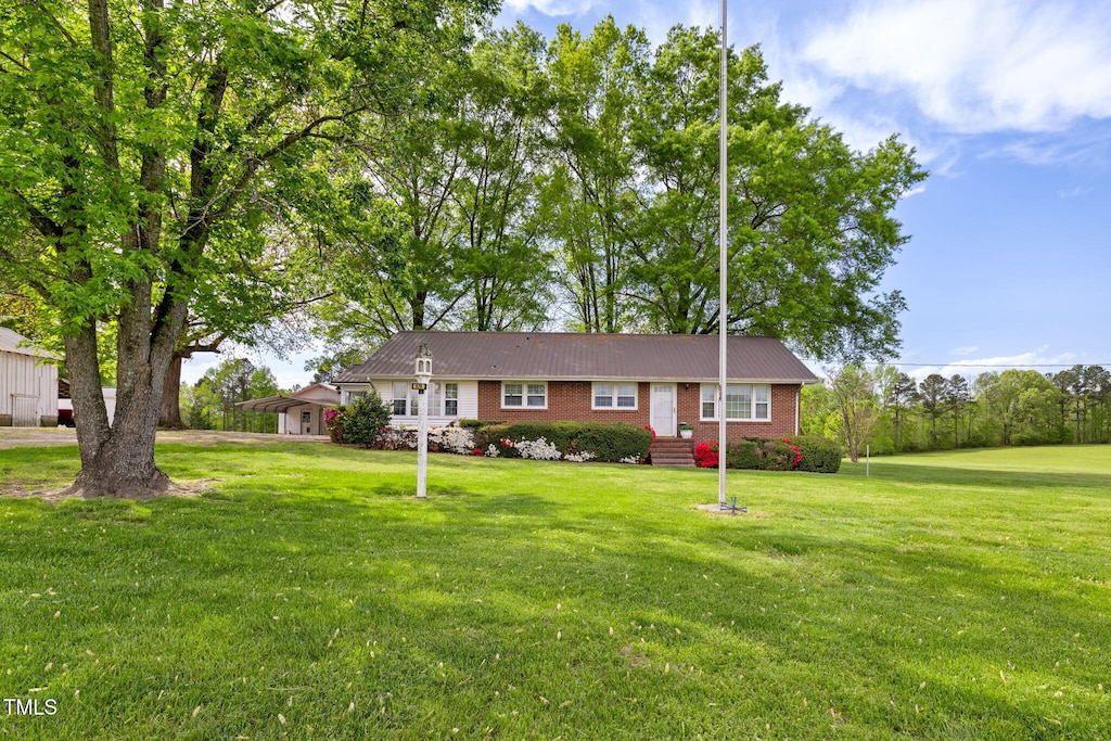 575 Paschall Station Rd, Warrenton, NC 27589 - ranch-style home featuring a front yard and brick siding