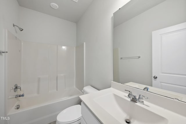 full bath featuring toilet, vanity, and tub / shower combination