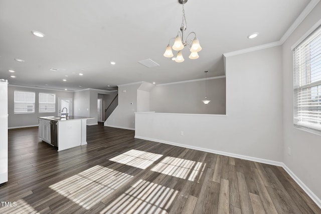 unfurnished living room with a chandelier, baseboards, ornamental molding, and recessed lighting