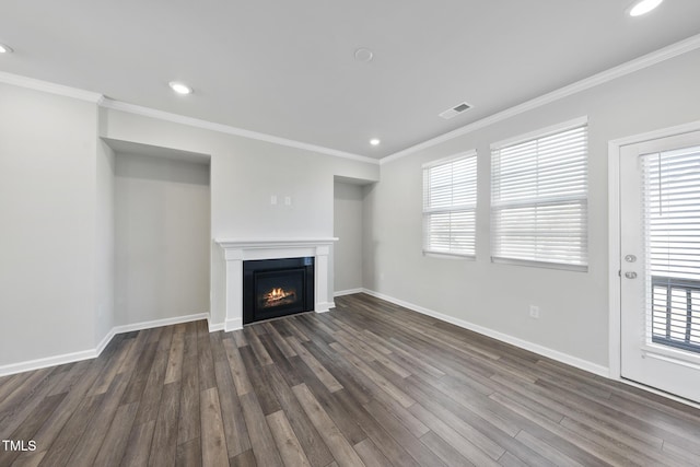 unfurnished living room featuring recessed lighting, crown molding, baseboards, and dark wood-style flooring