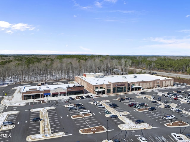aerial view featuring a wooded view