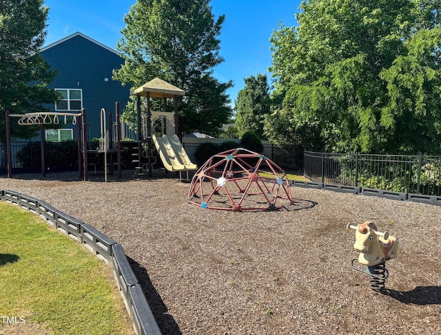 community jungle gym featuring fence