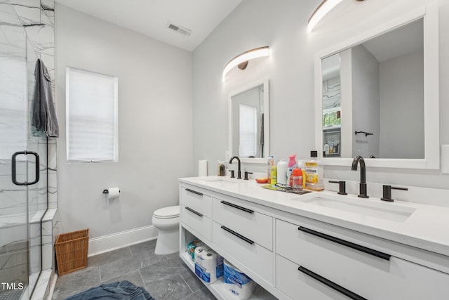 bathroom with visible vents, a sink, a marble finish shower, and toilet