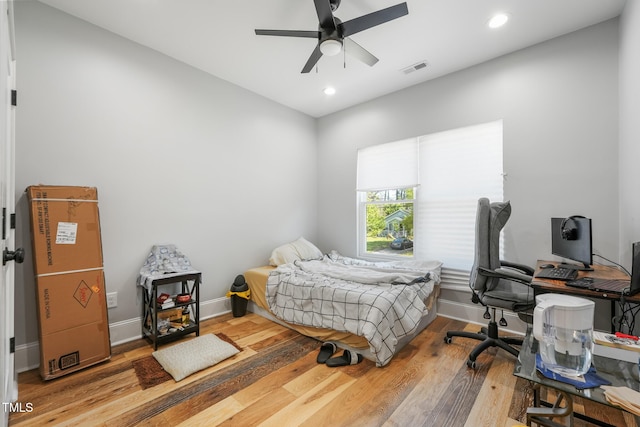 bedroom featuring baseboards, visible vents, recessed lighting, a ceiling fan, and wood finished floors