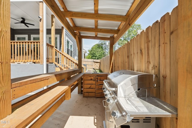 view of patio / terrace with fence and a grill