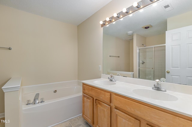 1031 Lake Moraine Pl, Raleigh, NC 27607 - bathroom featuring a shower stall, a garden tub, double vanity, and tile patterned flooring