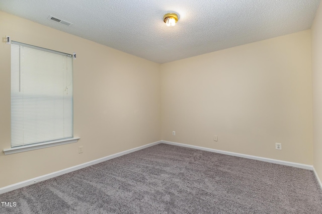 1031 Lake Moraine Pl, Raleigh, NC 27607 - carpeted spare room featuring baseboards and a textured ceiling