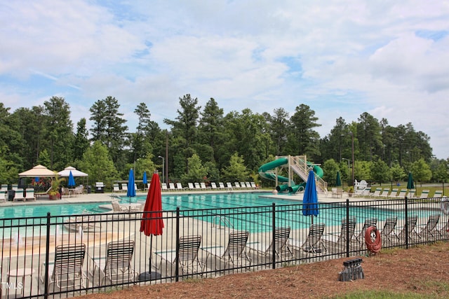 313 Carthage Ct, Durham, NC 27703 - community pool with fence, a water slide, and a patio area