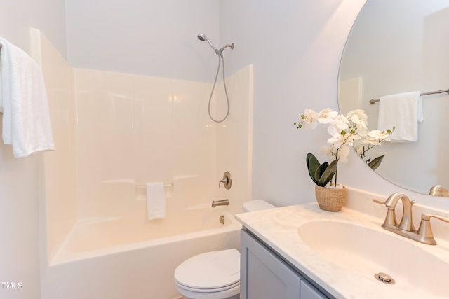 bathroom with vanity, shower / tub combination, and toilet