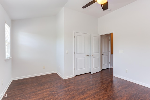 313 Carthage Ct, Durham, NC 27703 - unfurnished room with baseboards, a ceiling fan, and dark wood-style floors