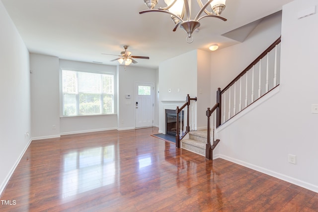313 Carthage Ct, Durham, NC 27703 - entryway featuring baseboards, stairs, ceiling fan with notable chandelier, and wood finished floors