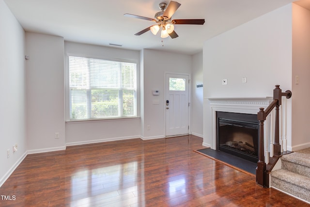 313 Carthage Ct, Durham, NC 27703 - unfurnished living room featuring a fireplace, a ceiling fan, wood finished floors, and visible vents