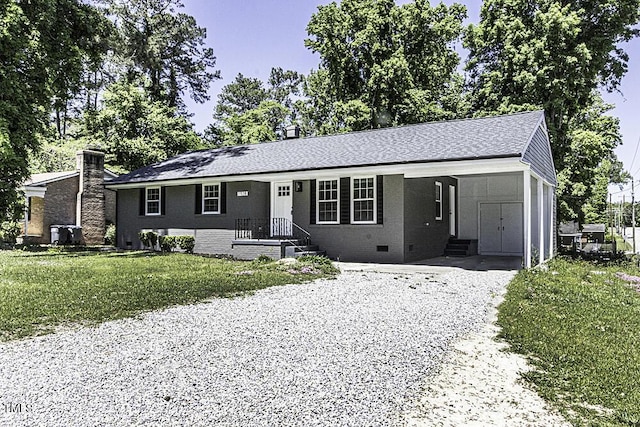 single story home with a front lawn, crawl space, a carport, brick siding, and gravel driveway