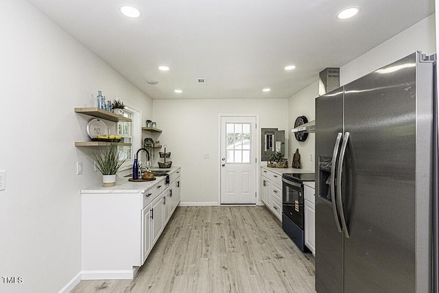 kitchen featuring a sink, black / electric stove, stainless steel refrigerator with ice dispenser, and open shelves