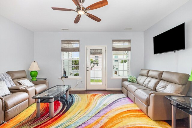 412 Stone Flower Ln, Raleigh, NC 27603 - living area with baseboards, a ceiling fan, and wood finished floors