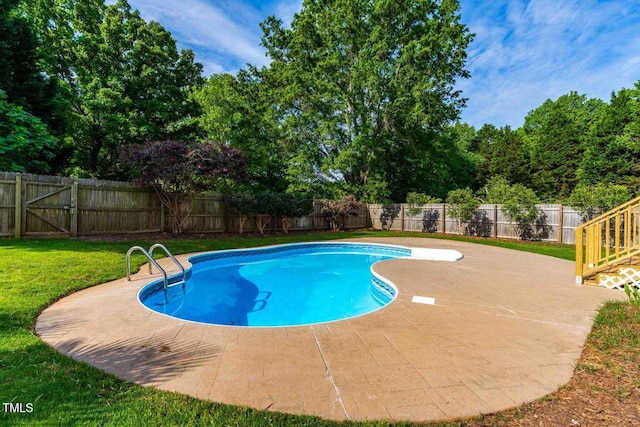 view of pool with a fenced in pool, a yard, a fenced backyard, and a patio area
