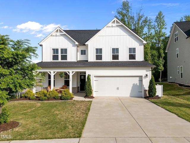 view of front of house featuring a porch, an attached garage, board and batten siding, and concrete driveway