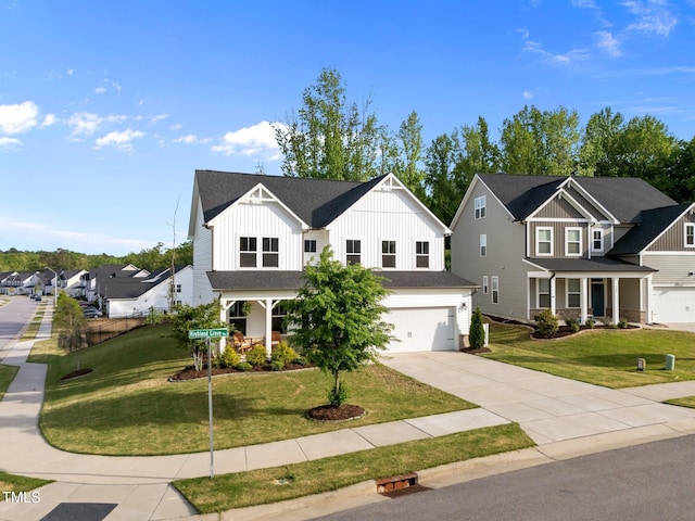 traditional-style house featuring board and batten siding, a residential view, a porch, and a front lawn